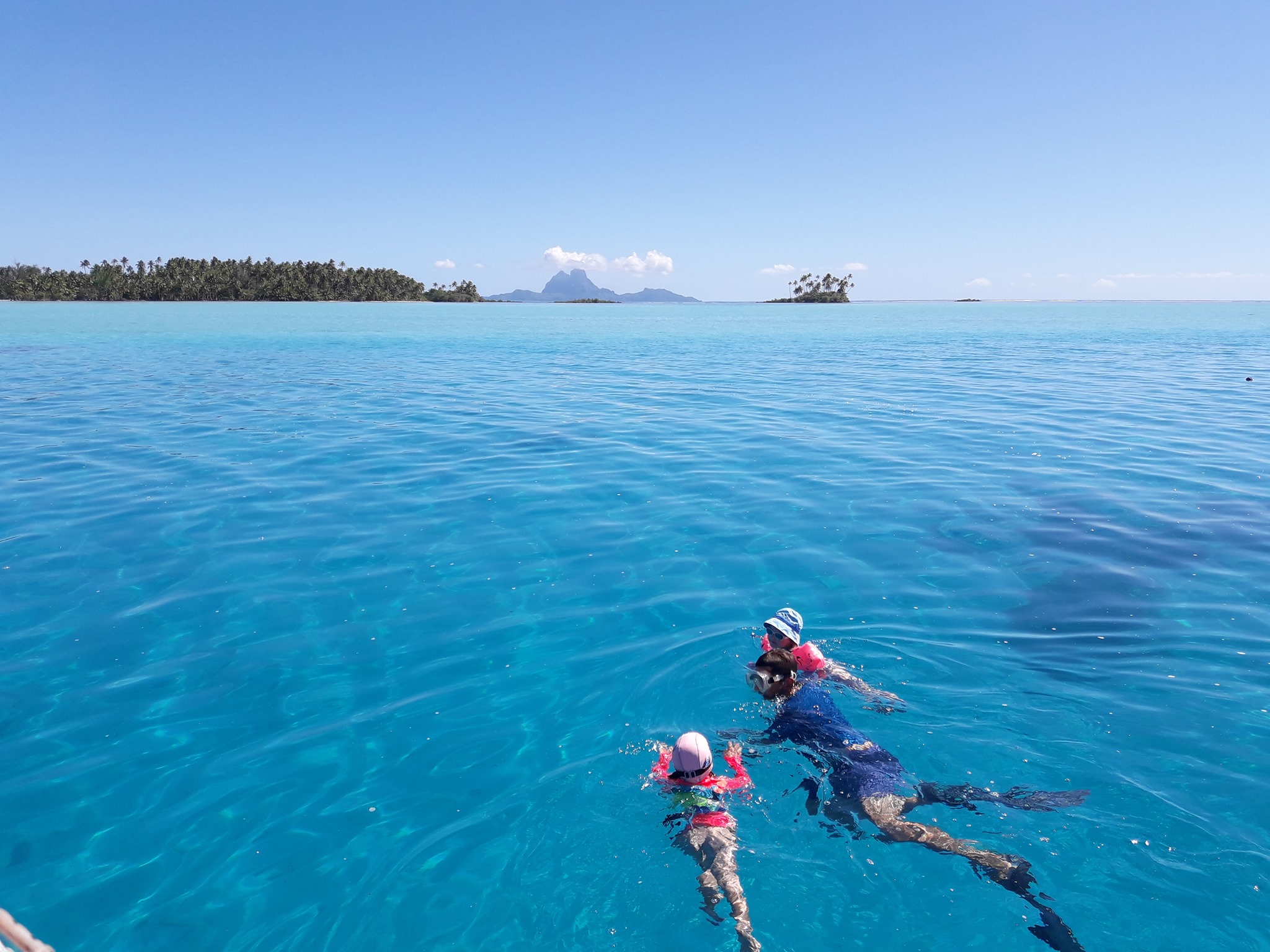 Swimming at Tahaa, Bora Bora in the background